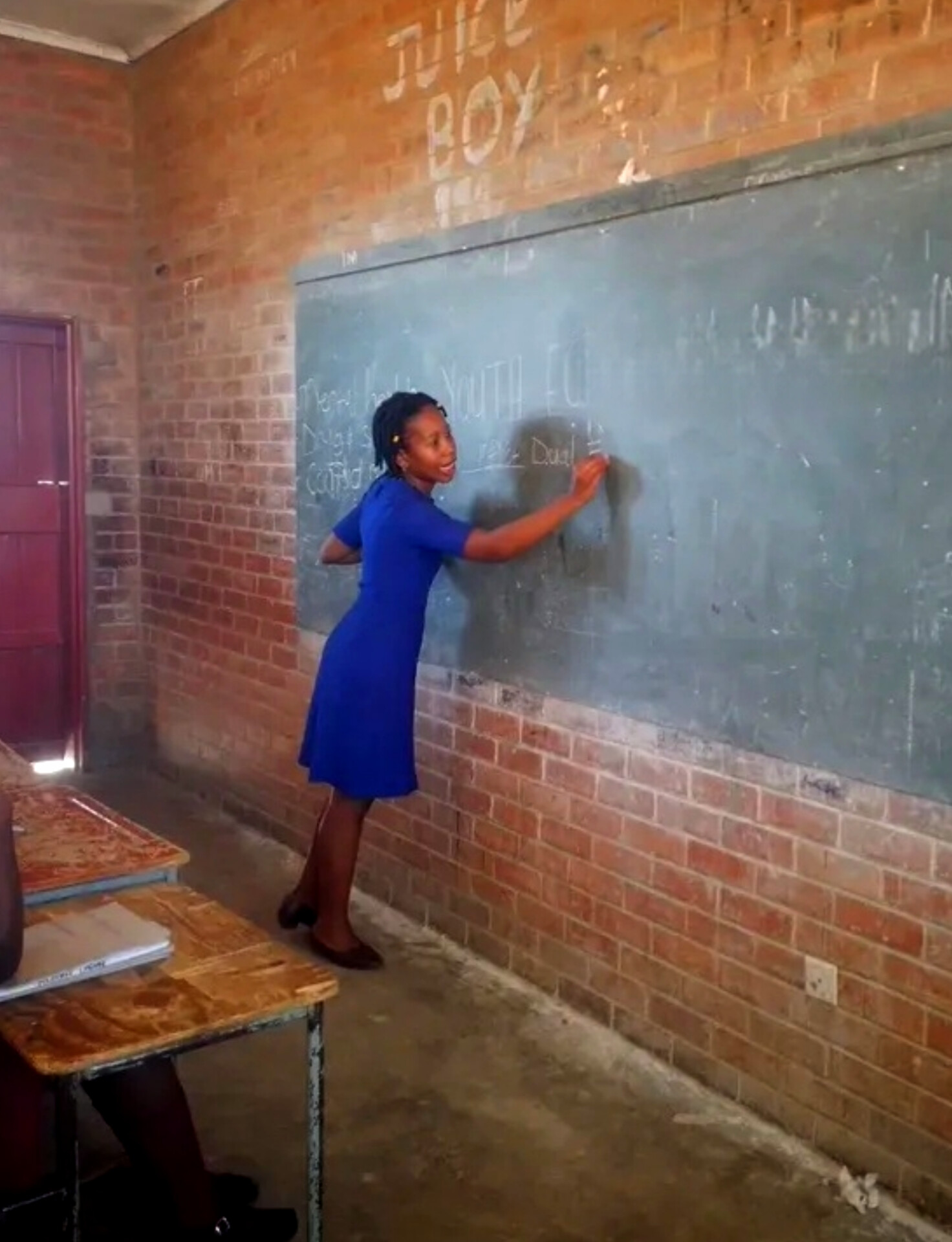 Facilitator leading a session at the chalkboard